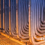 An interior view showcasing a large collection of pipes densely packed in a room.