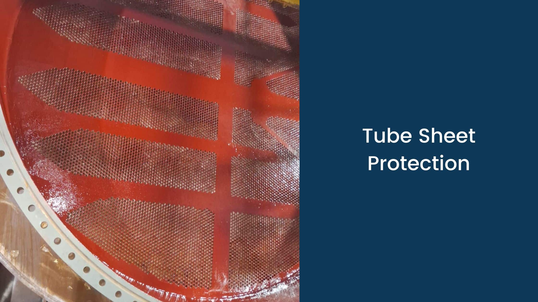 Close-up of tube sheet coated with red epoxy lining for corrosion protection